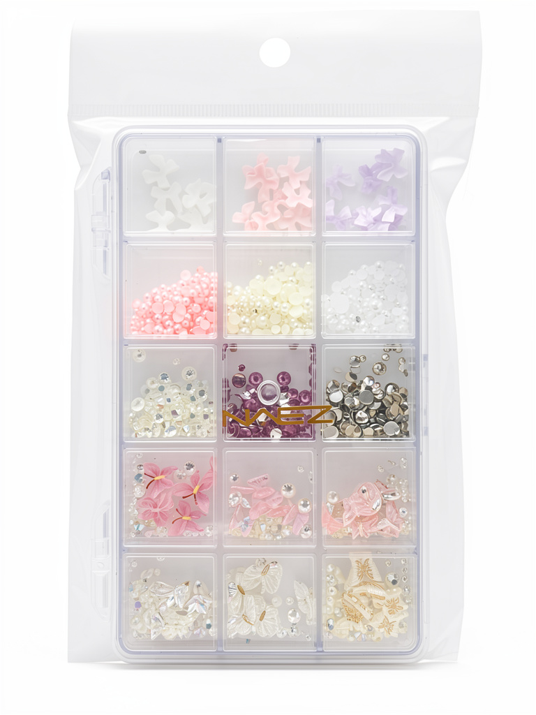Decoración Naez surtida (strass, perlas, moños, dijes) x15 divisiones
