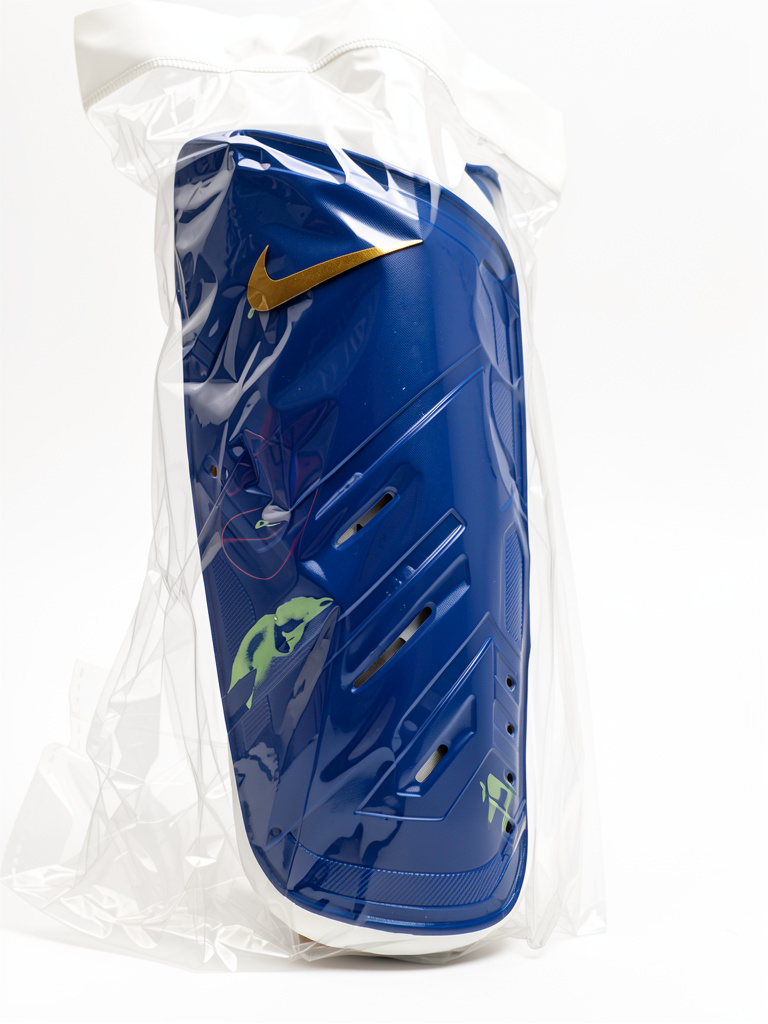 Nike azul espinillera