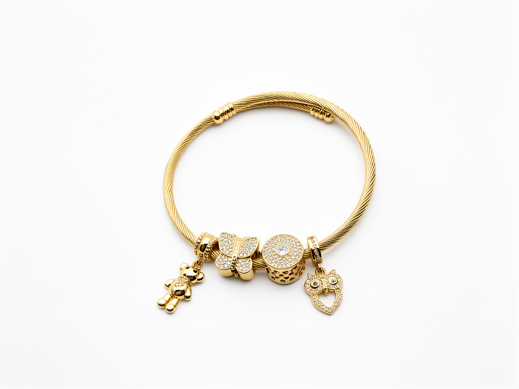 105049 - Pulsera charms, Bronce con baño en oro.