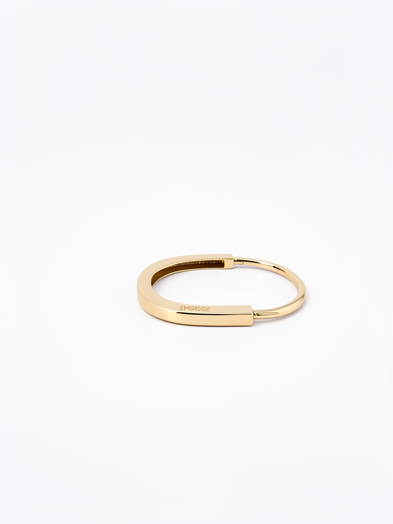 Brazalete ovalado dorado en baño 18k