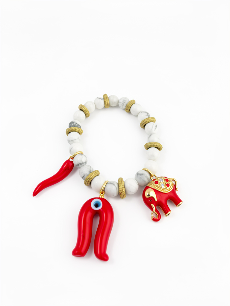 Pulsera elásticacon de piedra howlita blanca dijes cornicello, elefante y ojo turco herradura rojo