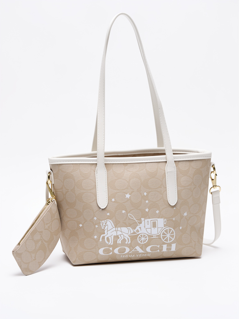 Cartera  mediana coach beige con blanco