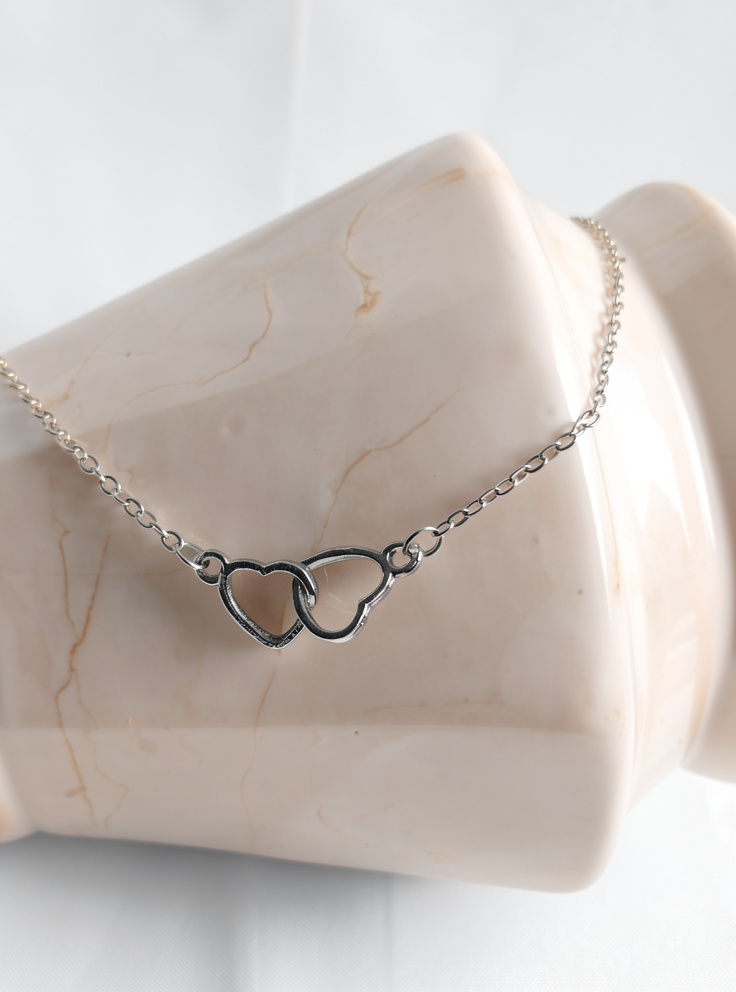 COLLAR CORAZONES ENTRELAZADOS SILUETA ACERO INOX. SILVER