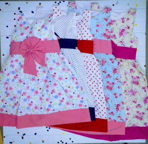 PN0169 VESTIDO ESTAMPADO NENA CON  APLIQUE DE MOÑO EN EL CENTRO
