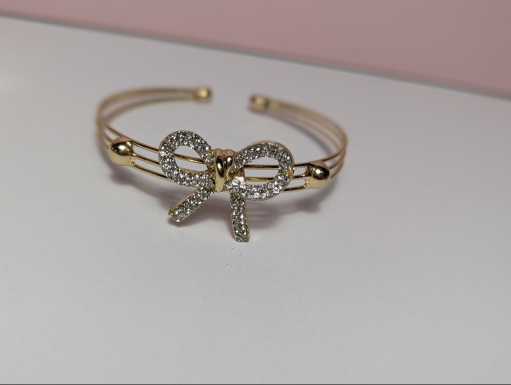Brazalete dorado lazo con zirconia