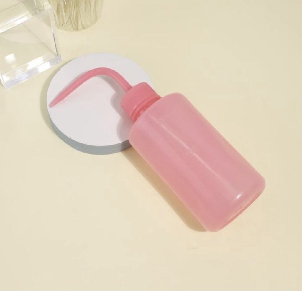 Botella pico limpiadora