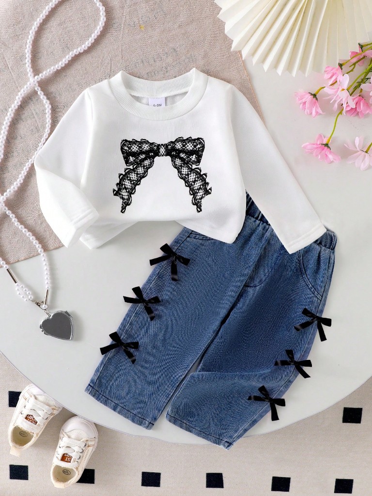 Conjunto pantalón y suéter con lazos
