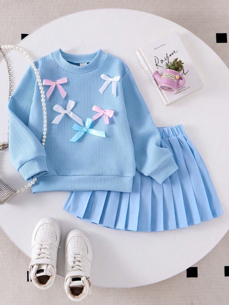 Conjunto de Falda azul y Suéter azul con lazos
