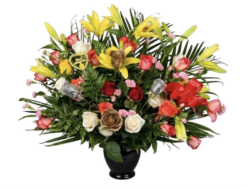 Golden Lily and Mixed Rose Arrangement (Yellow Lilies, Red, White and Peach Roses, Pink Mini Carnations, Gold and Silver Roses, Greenery in an Arrangement with Ribbon)
