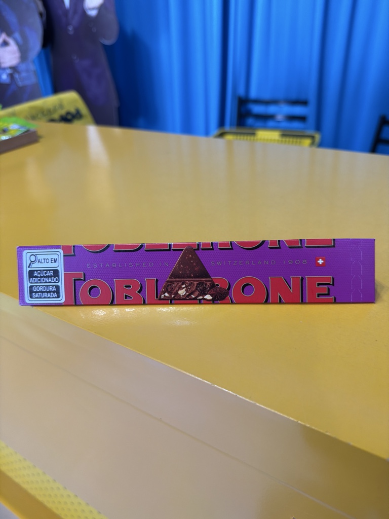 Toblerone choc ao leite com uva passa, mel e amendoas 100gr