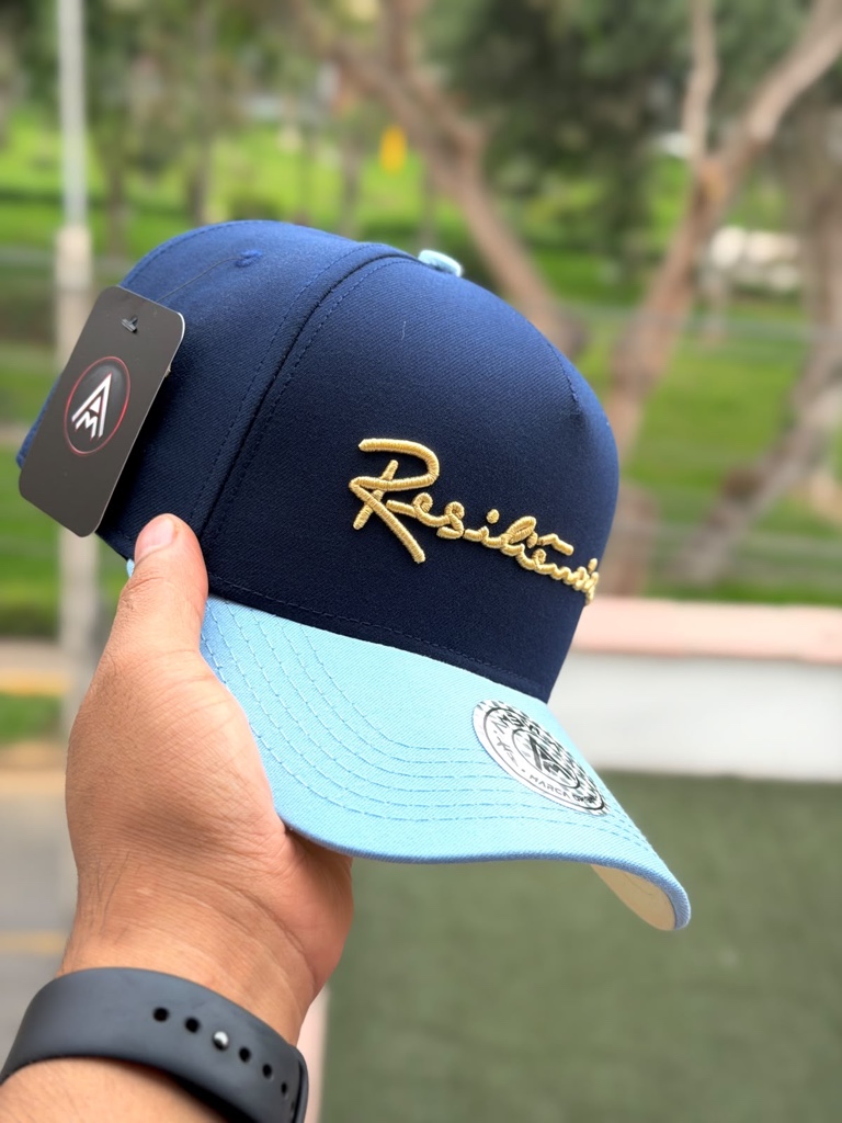 Gorra azul marino y celeste Resiliencia