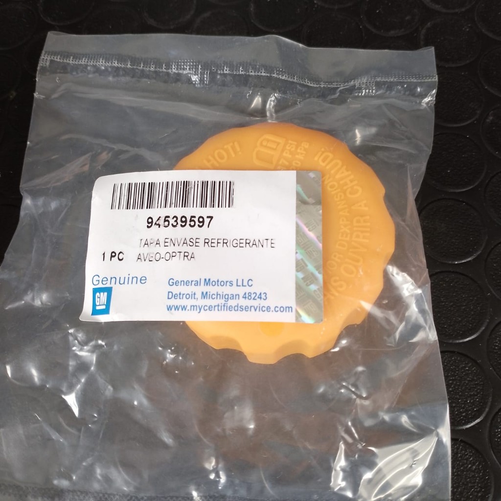 aveo Optra GM tapa envase refrigerante naranja