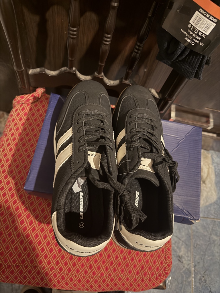 Le Coq Sportif negras