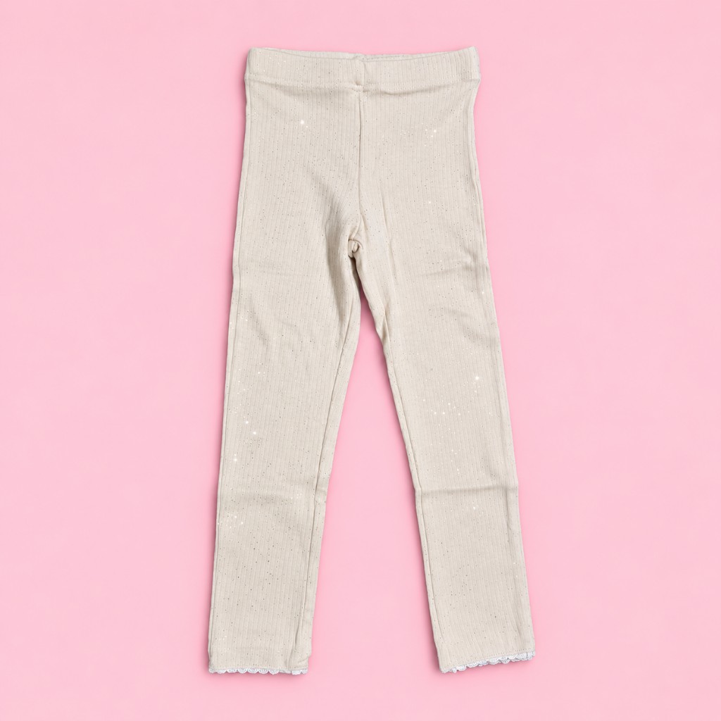 Leggings crema con brillos