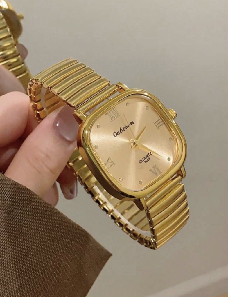 Reloj dorado de cuarzo minimalista