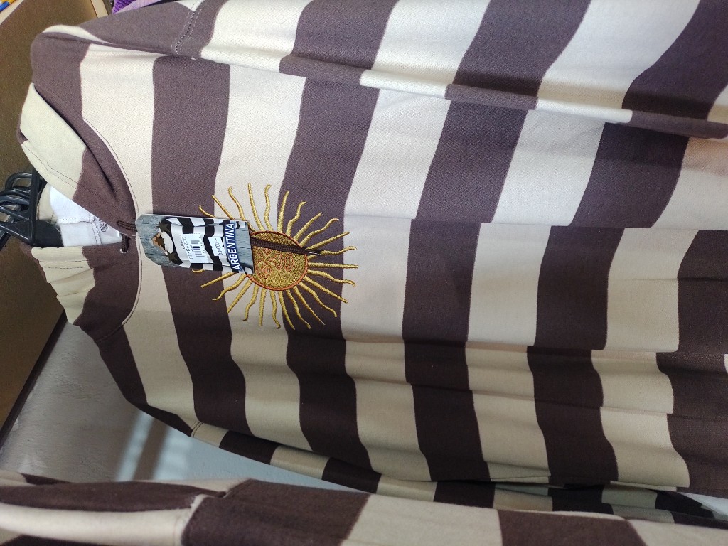 Buzo rayado beige y marron sol