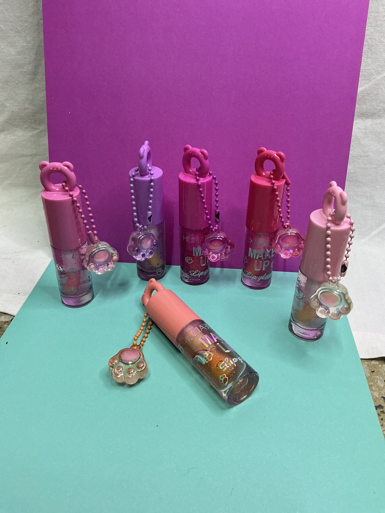 Lipgloss llavero de patita de gatito. 1 unidad