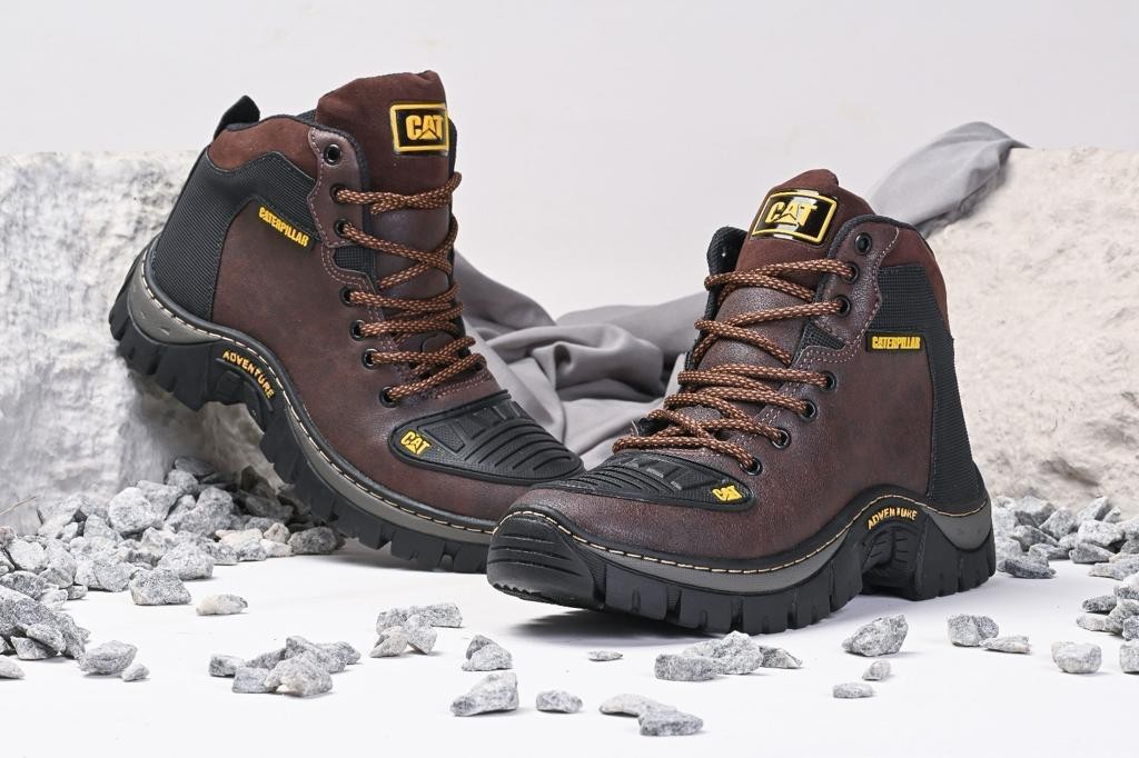 CAT botines marron negros