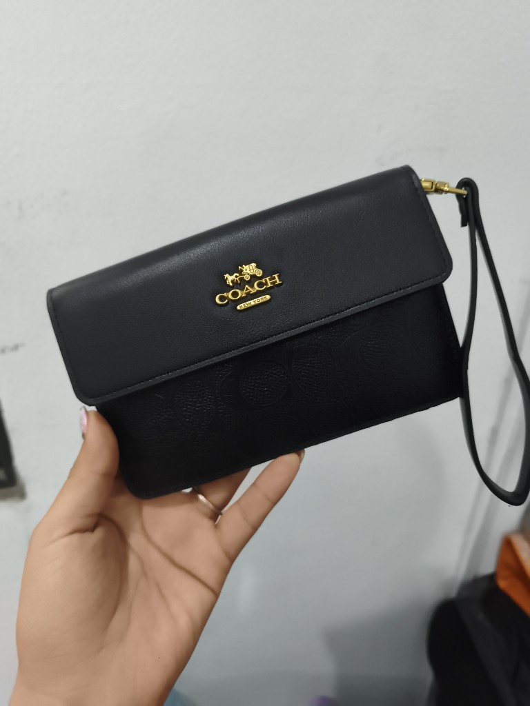 CARTERA/MUÑEQUERA COACH NEGRA