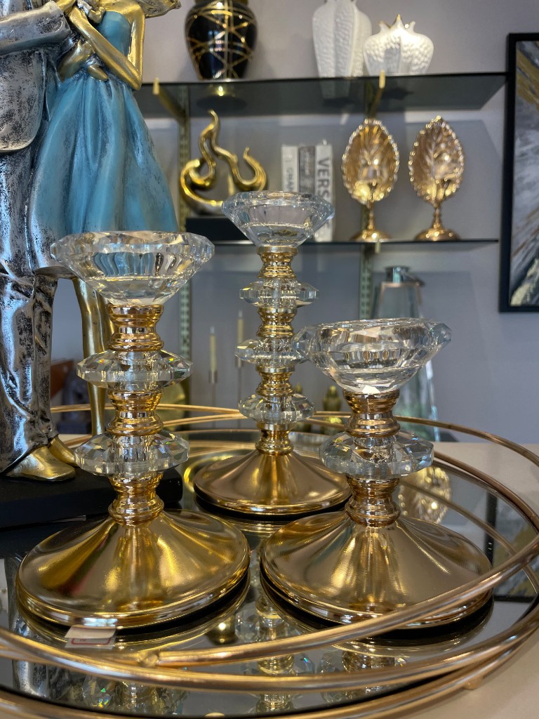 Candelabros dorados con cristal grande