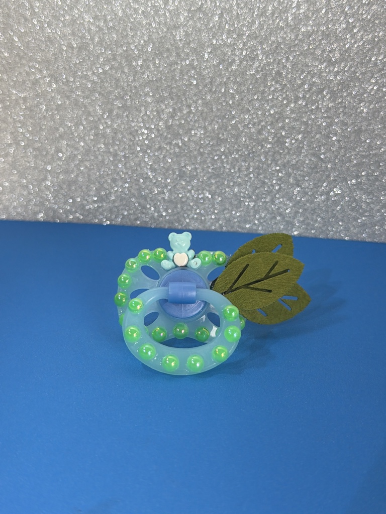 Chupeta verde com folha