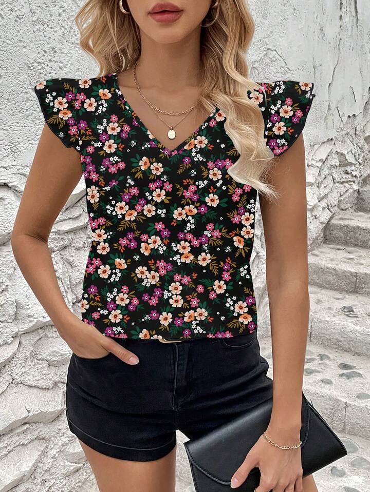 Blusa negra flores rosadas