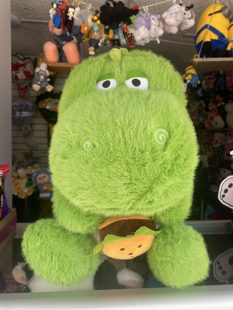 Dino verde peluche