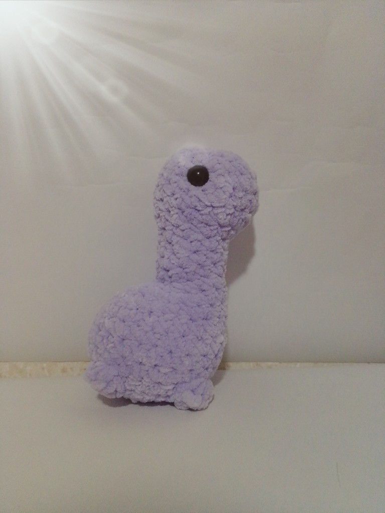 Peluche dinosaurio lila