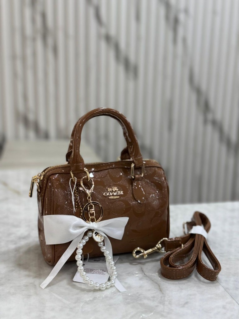 Coach cartera marron con lazo