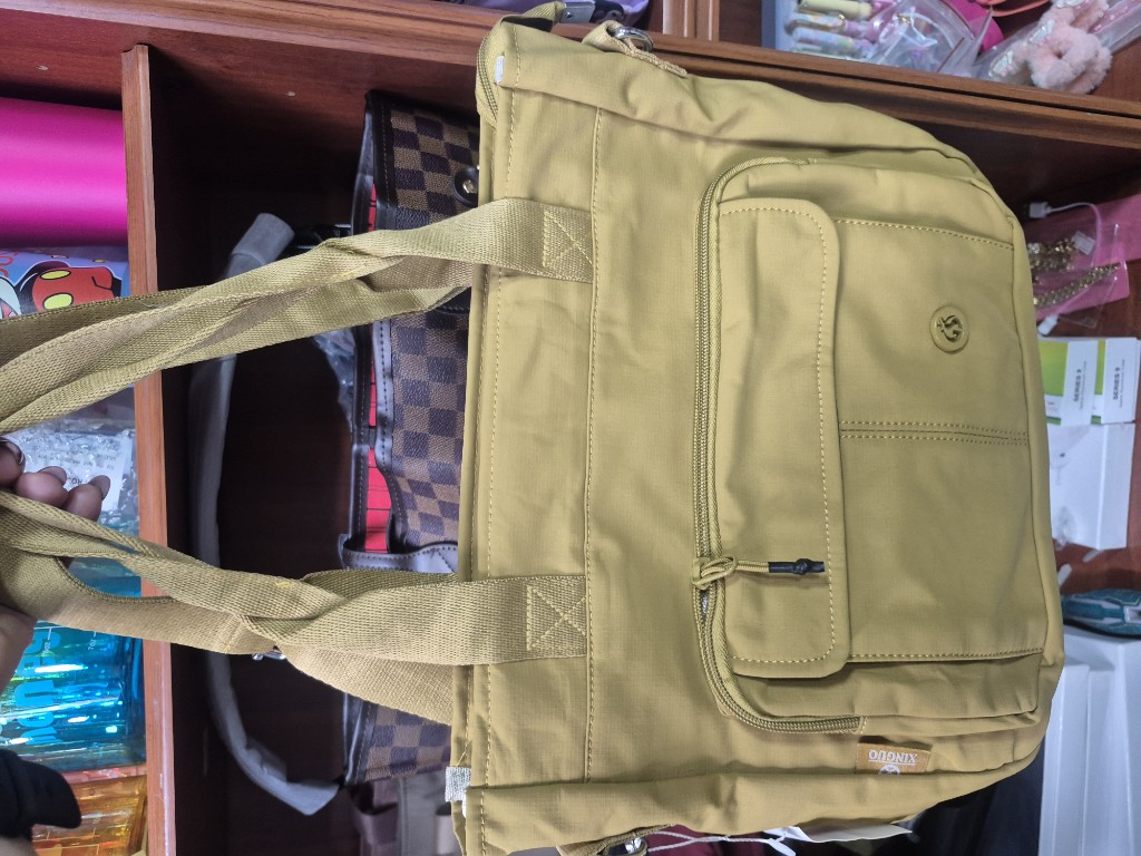 Cartera verde oliva y rosa