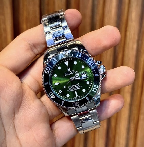 Reloj Rolex plateado verde