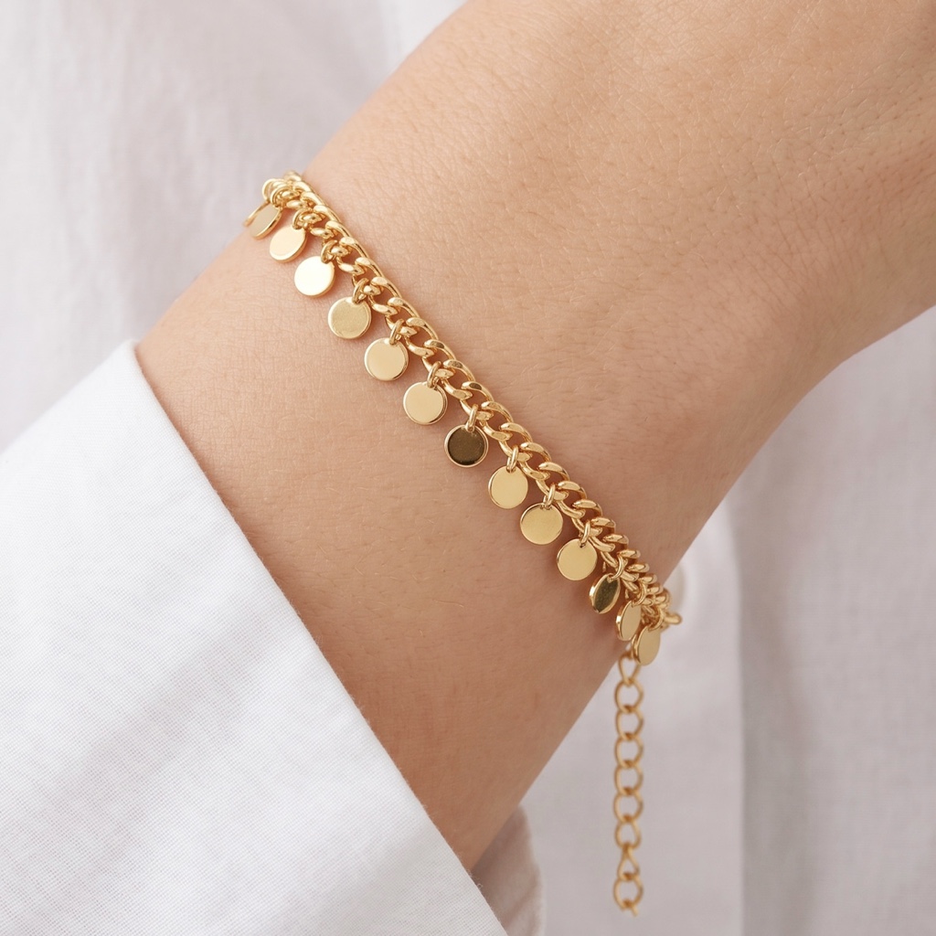 Pulseira dourada com pingentes bolinha