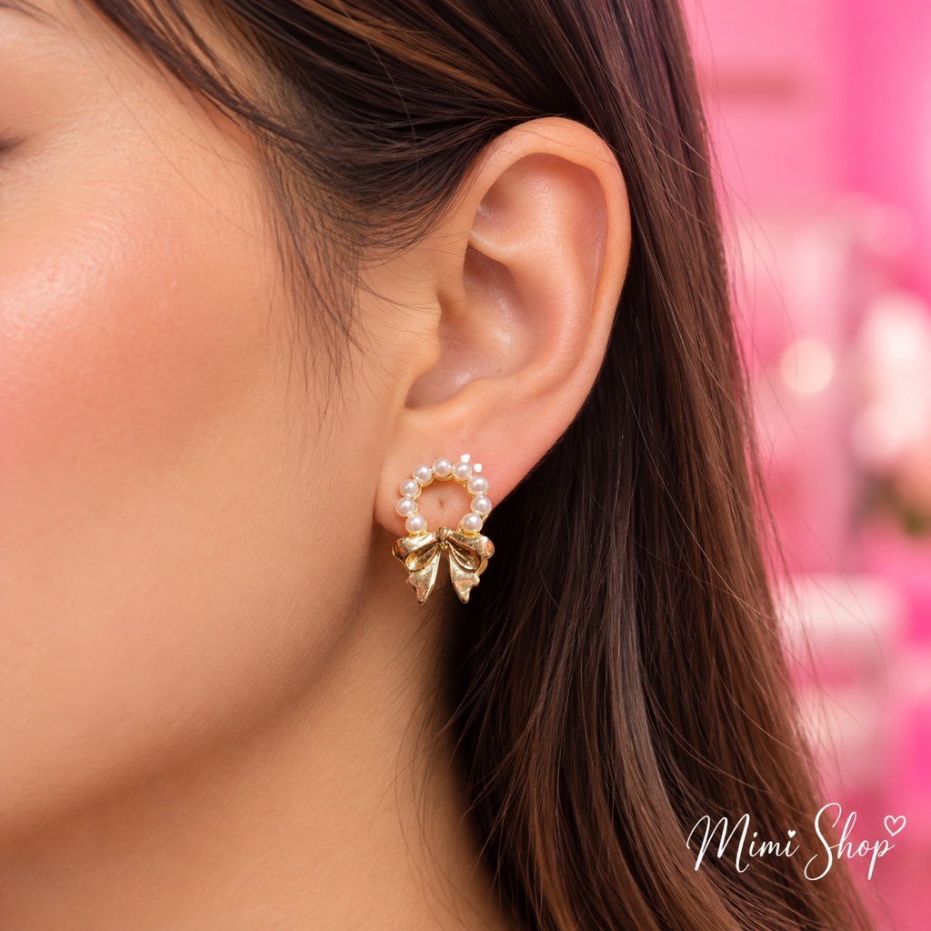 Aretes perla y moño dorados