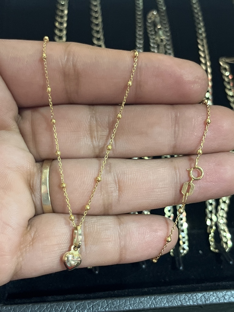 Cadena fina con bolitas dije de corazón oro 10k