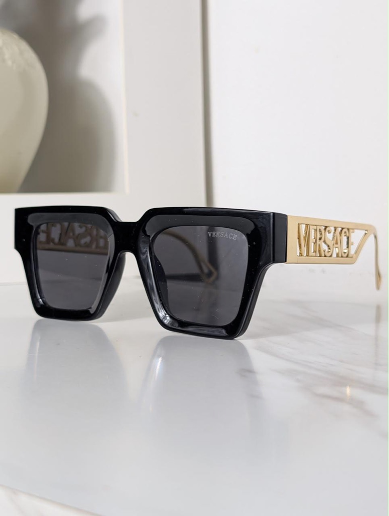 Versace lentes negros con dorado