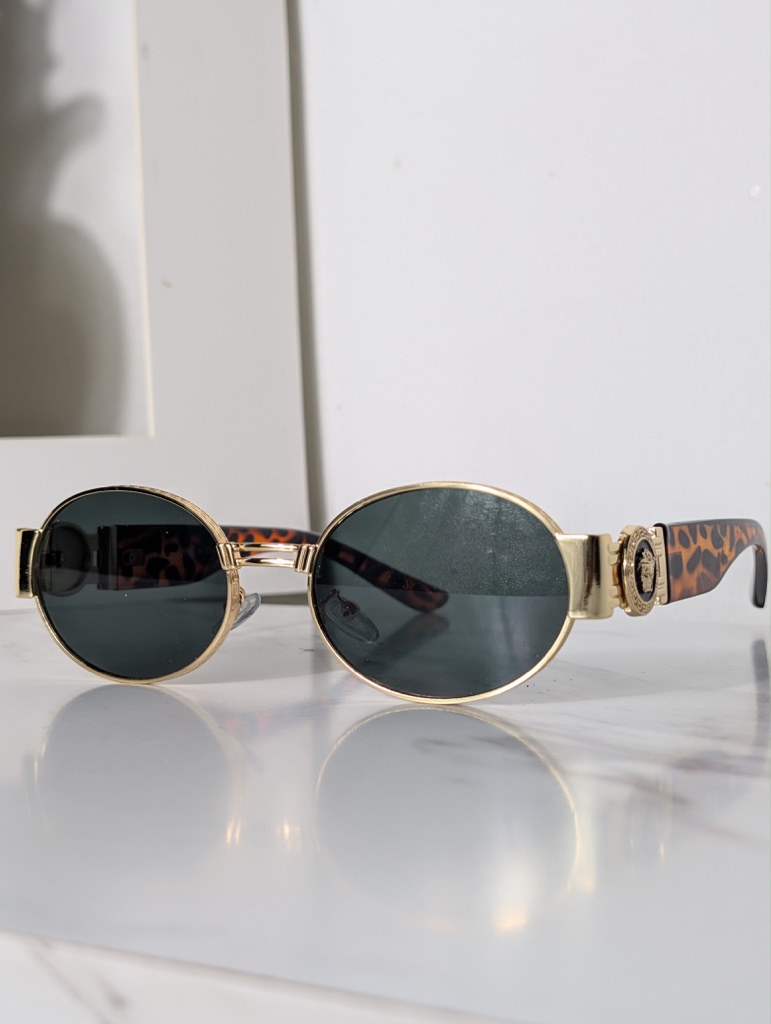 Versace lentes negros redondos