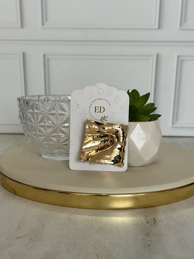 ED broche dorado