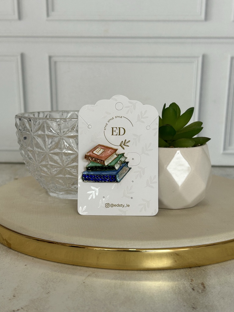 ED broche libros