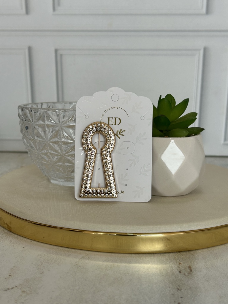 Broche dorado con strass
