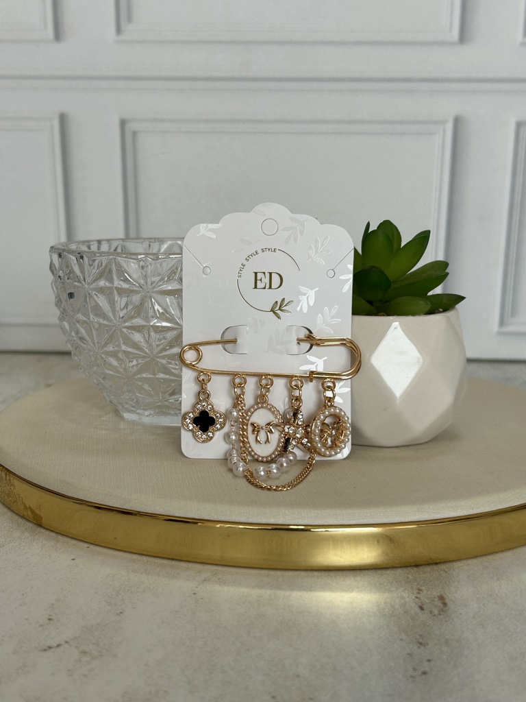 ED broche dorado con dijes