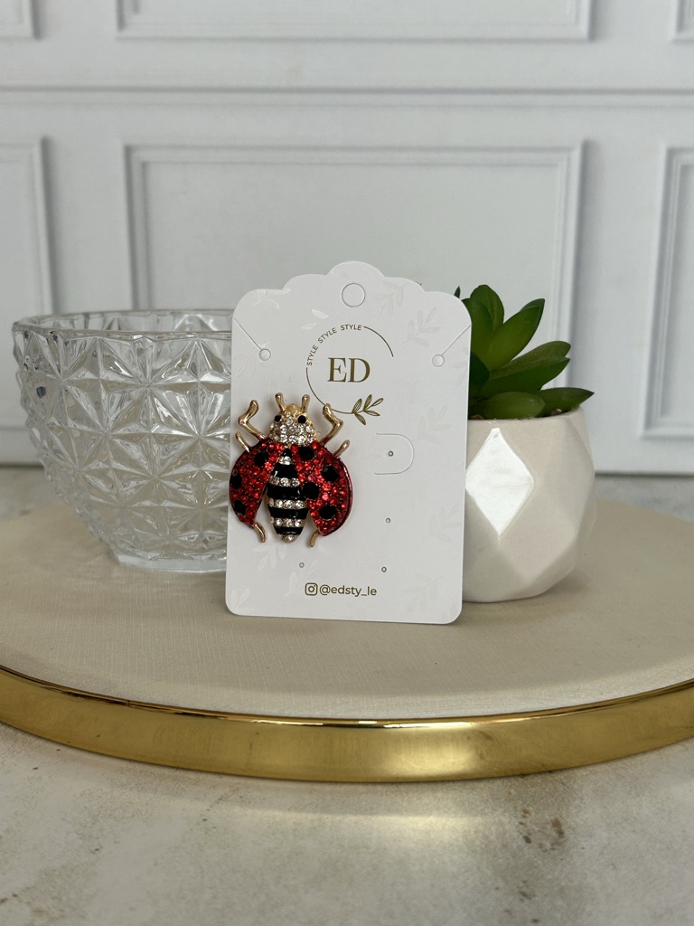 ED broche mariquita roja
