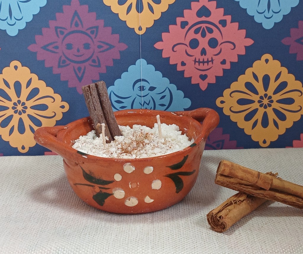 Vela cazuelita arroz con leche raja de canela