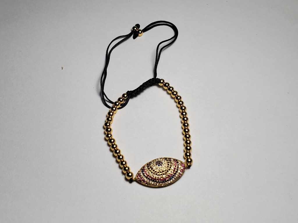 Pulsera dorada con dije ojo