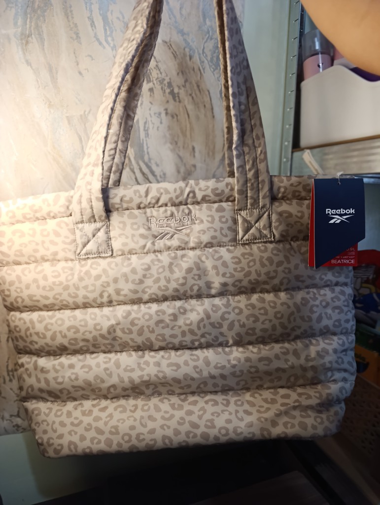 Reebok bolsa beige estampada