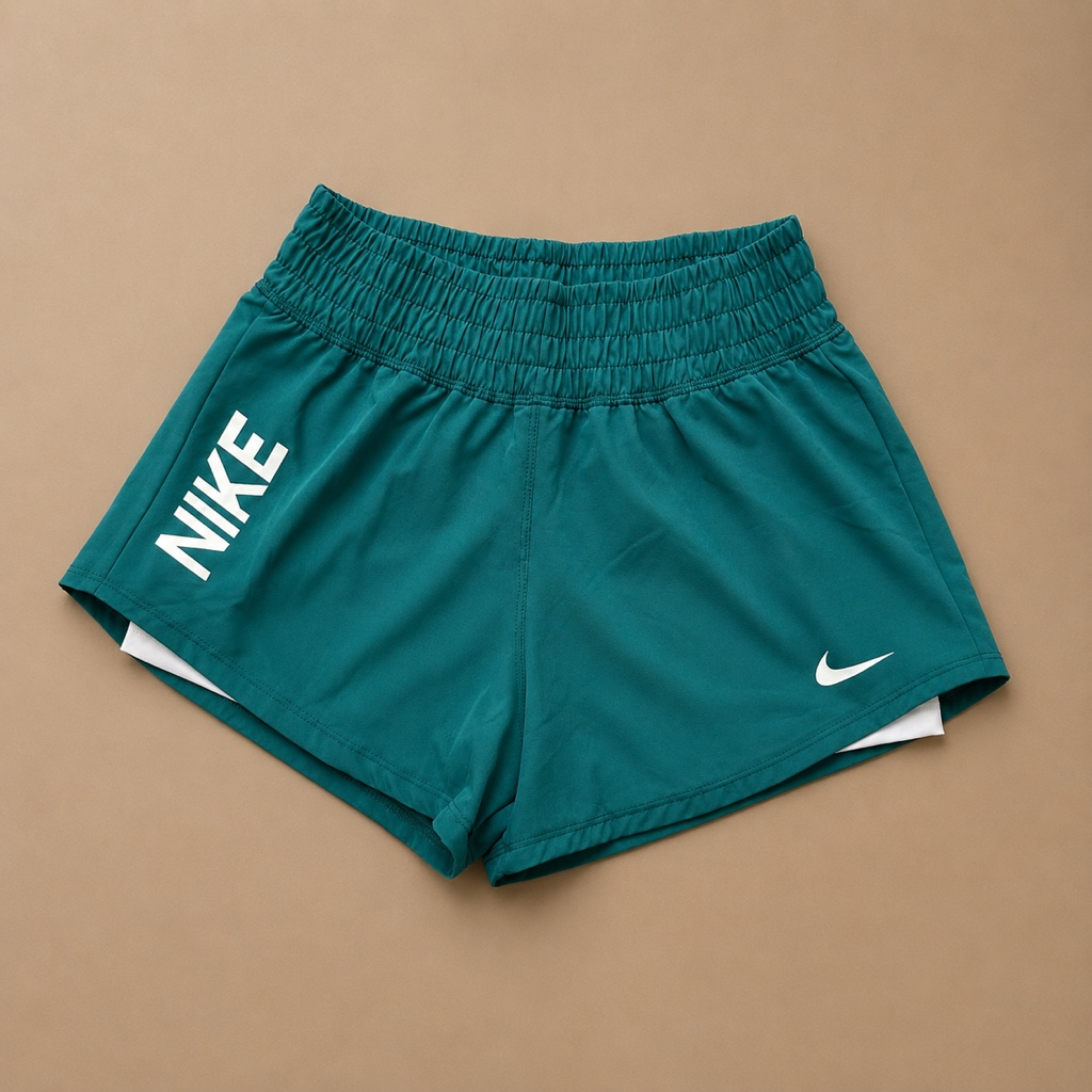 Pantaloneta Nike logo verde