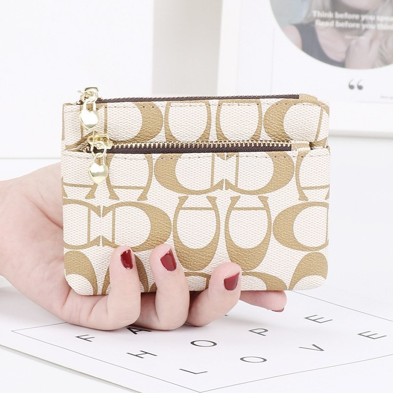 Monedero de dama coach blanco