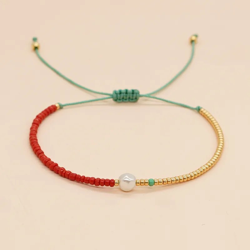 Pulsera de hilo color rojo + dorado con perla
