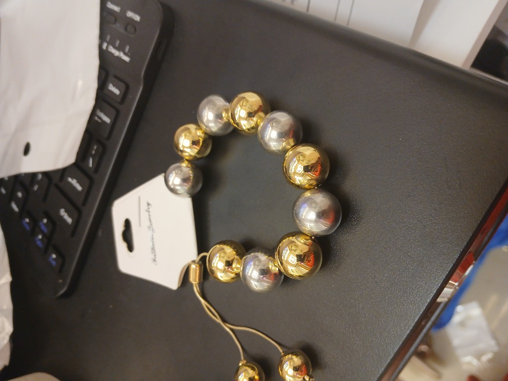 Pulsera esferas dorada y plateada