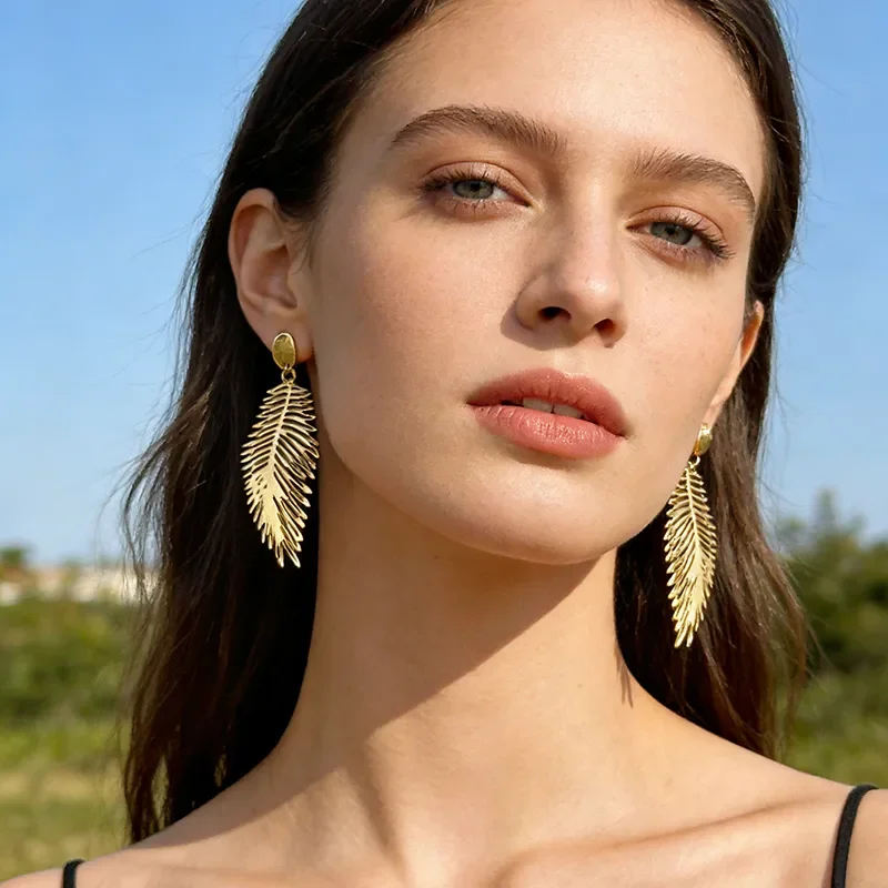 aretes pluma acero