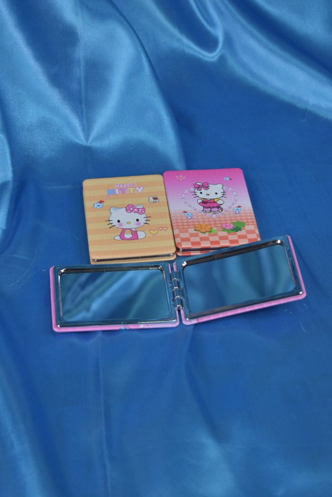 Espejo mini de mano doble con aumento hello kitty surtida